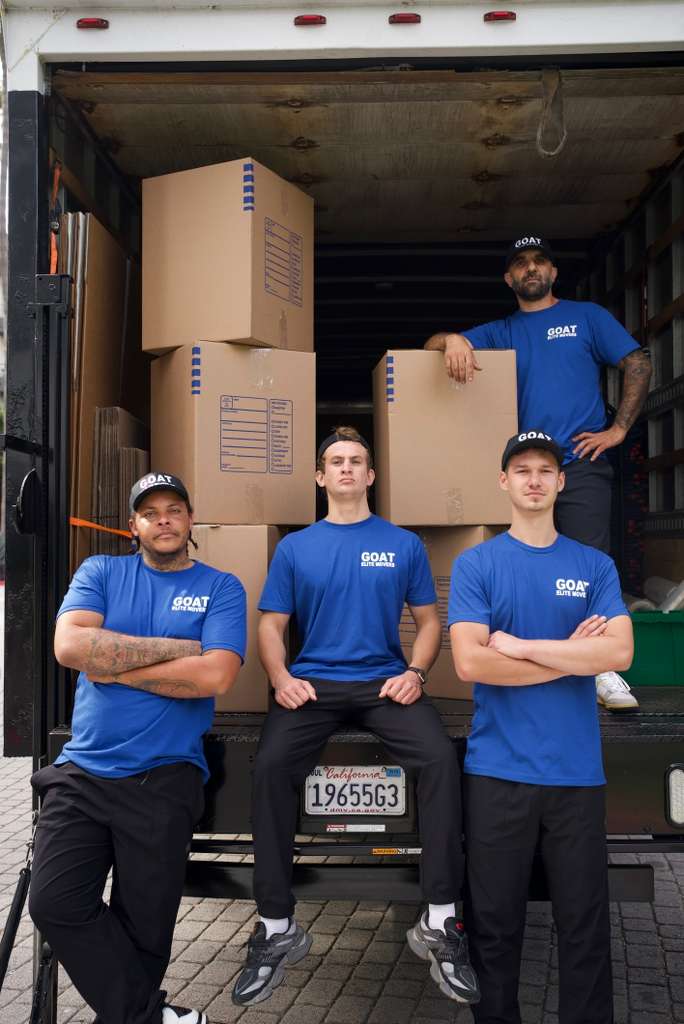 Crew posing inside a fully loaded truck