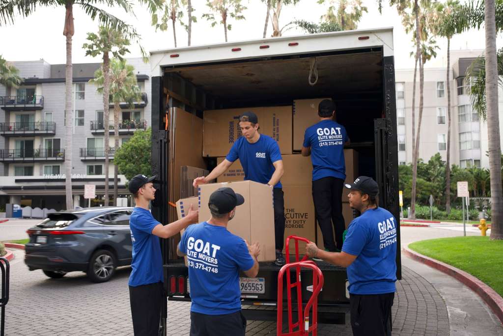 Crew loading wardrobe boxes